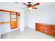 Bedroom with a closet organizer and a wooden dresser at 7647 Navigator Ct, Port Richey, FL 34668