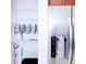 Organized pantry with wire shelving and stainless steel refrigerator visible at 7647 Navigator Ct, Port Richey, FL 34668