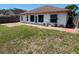Backyard features a patio and partially fenced yard at 8908 Southbay Dr, Tampa, FL 33615