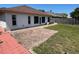 Backyard has brick patio and partially fenced yard at 8908 Southbay Dr, Tampa, FL 33615