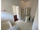 A modern bathroom with a glass-enclosed shower stall and a separate toilet area provides comfort and privacy at 8908 Southbay Dr, Tampa, FL 33615