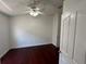 Bedroom features a ceiling fan and door to closet at 8908 Southbay Dr, Tampa, FL 33615