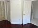 Bedroom showcasing dark hardwood flooring and an ensuite bathroom at 8908 Southbay Dr, Tampa, FL 33615