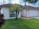 Charming single Gathering home with well manicured lawn and attached two car garage at 8908 Southbay Dr, Tampa, FL 33615