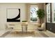 Well-lit dining room with a modern table, seating for four, and a decorative plant, perfect for gatherings at 9328 Gladsome Dr, Land O Lakes, FL 34637
