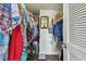 Walk-in closet with hanging clothes, shelves and storage, plus a mirror, and room for organization at 9450 Harbor Greens Way # 403, Seminole, FL 33776