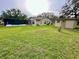 Expansive backyard featuring a screened pool area and a storage shed, perfect for outdoor enjoyment and storage at 10206 Lakeview Dr, New Port Richey, FL 34654