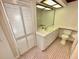 Bathroom with white vanity, sink, and mirror at 10206 Lakeview Dr, New Port Richey, FL 34654