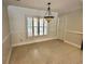 Dining room with tile flooring, a modern chandelier, and plantation shutters at 10206 Lakeview Dr, New Port Richey, FL 34654