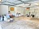 A large garage features block walls, overhead lighting, and a table at 10206 Lakeview Dr, New Port Richey, FL 34654
