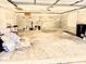 Spacious garage featuring block walls, overhead lighting, and ample storage space at 10206 Lakeview Dr, New Port Richey, FL 34654