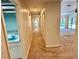 Hallway leading to a bathroom and living room with a view of the pool at 10206 Lakeview Dr, New Port Richey, FL 34654