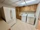 Laundry room featuring washer and dryer hookups and wood cabinetry at 10206 Lakeview Dr, New Port Richey, FL 34654