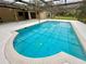 A private screened-in pool offers a refreshing outdoor retreat, perfect for relaxation and recreation at 10206 Lakeview Dr, New Port Richey, FL 34654