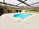 Inviting screened-in pool surrounded by ample deck space for lounging and enjoying the outdoors at 10206 Lakeview Dr, New Port Richey, FL 34654