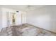 Bedroom with dated carpet, ceiling fan, and doorway leading to the bathroom at 10215 Regal Dr # 21, Largo, FL 33774