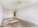 View of a dated living room featuring mirrored wall and sliding doors to balcony at 10215 Regal Dr # 21, Largo, FL 33774