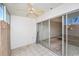 Enclosed sunroom featuring white tile floor, neutral walls and ceiling fan at 10215 Regal Dr # 21, Largo, FL 33774