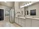 Bright bathroom featuring corner tub with a shower, double vanity, and tile floors at 10322 Riverburn Dr, Tampa, FL 33647
