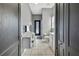 Spacious bathroom featuring tile floors, a vanity area, and a shower behind a decorative curtain at 10322 Riverburn Dr, Tampa, FL 33647