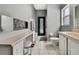 Bathroom featuring tile floors, a vanity area, toilet and a shower behind a decorative curtain at 10322 Riverburn Dr, Tampa, FL 33647