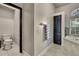 Bright bathroom features a toilet room and large soaking tub under a window at 10322 Riverburn Dr, Tampa, FL 33647