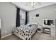Bedroom with carpeted floor, window, vanity and bed at 10322 Riverburn Dr, Tampa, FL 33647