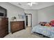 Bedroom with dresser, closet, and a bed at 10322 Riverburn Dr, Tampa, FL 33647