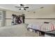 Spacious bedroom with neutral-toned walls, a ceiling fan, and ample space for closet systems at 10322 Riverburn Dr, Tampa, FL 33647