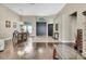Foyer featuring high ceilings, hardwood floors, chandelier, and decorative archways at 10322 Riverburn Dr, Tampa, FL 33647