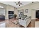 Spacious living room with a fireplace, high ceilings, and hardwood floors at 10322 Riverburn Dr, Tampa, FL 33647