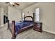Main bedroom featuring a king bed, carpet, and windows with blinds at 10322 Riverburn Dr, Tampa, FL 33647