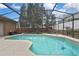 Secluded backyard with screened-in pool, perfect for outdoor enjoyment and relaxation at 10322 Riverburn Dr, Tampa, FL 33647