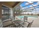 Relaxing screened lanai featuring a pool, patio seating and clear view of the sky at 10322 Riverburn Dr, Tampa, FL 33647