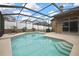 Backyard screened in pool with serene views and a cozy hammock for relaxation at 10322 Riverburn Dr, Tampa, FL 33647