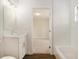 Modern bathroom featuring vanity with a view into the attached carpeted bedroom at 106 Ne 1St Ave, Lutz, FL 33549