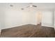 Bedroom with ceiling fan and hardwood floors at 106 Ne 1St Ave, Lutz, FL 33549