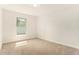 Carpeted bedroom with window at 106 Ne 1St Ave, Lutz, FL 33549