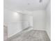 Upstairs hallway offers neutral gray carpet and a minimalist design, providing a calming transition space at 11717 Blackbrook Ct, Seffner, FL 33584