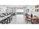 Bright, open-concept living area with access to patio, featuring modern tile floors, lots of natural light and stylish furniture at 11717 Blackbrook Ct, Seffner, FL 33584