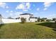 Spacious backyard with lush green grass, perfect for outdoor activities and relaxation at 11841 Thicket Wood Dr, Riverview, FL 33579