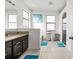 Bright bathroom showcasing granite countertops, bathtub, shower, and natural light at 11841 Thicket Wood Dr, Riverview, FL 33579