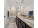 Bathroom featuring granite countertops, double sinks, tub, and tiled shower at 11841 Thicket Wood Dr, Riverview, FL 33579