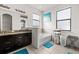 Bright bathroom showcasing granite countertops, bathtub, shower, and natural light at 11841 Thicket Wood Dr, Riverview, FL 33579