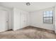 Bright bedroom features plush carpet, neutral walls and natural light from the window at 11841 Thicket Wood Dr, Riverview, FL 33579