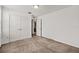 Comfortable bedroom features carpet, a closet, and access to an adjacent room at 11841 Thicket Wood Dr, Riverview, FL 33579