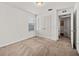 Comfortable bedroom features carpet, a closet, a window and access to an adjacent room at 11841 Thicket Wood Dr, Riverview, FL 33579
