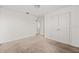 Comfortable bedroom featuring carpet, a closet, and access to an adjacent room at 11841 Thicket Wood Dr, Riverview, FL 33579