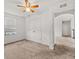 Comfortable bedroom features carpet, a closet, a ceiling fan, a window and access to an adjacent room at 11841 Thicket Wood Dr, Riverview, FL 33579