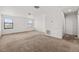 Bonus room featuring carpeted floors, natural light, and ample space for a variety of uses at 11841 Thicket Wood Dr, Riverview, FL 33579
